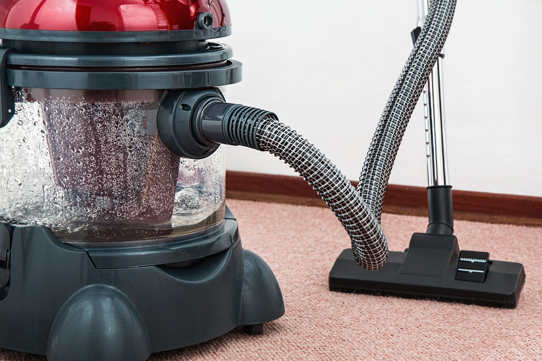 Vacuum cleaner head on carpet, representing in-shop vacuum service and parts